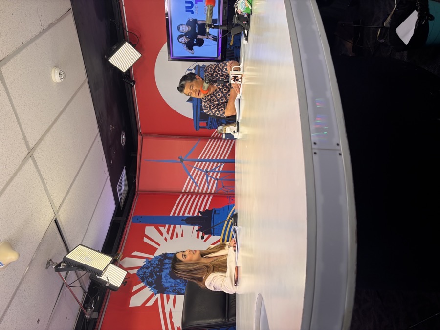Quetzal hosting a broadcast interview